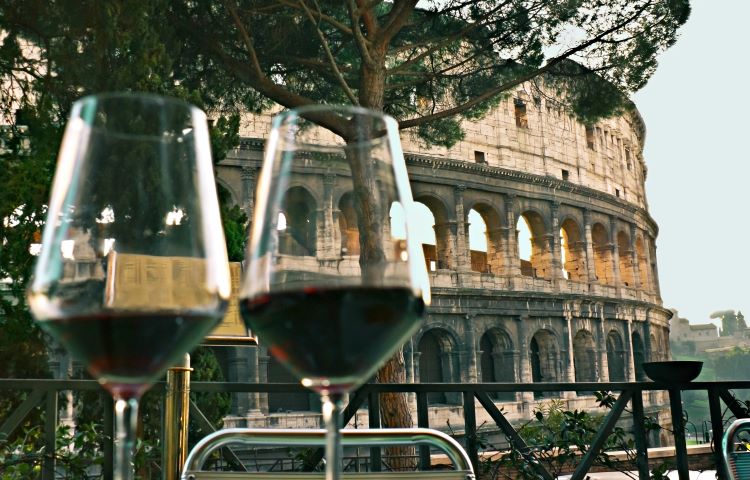 Two Wine Glasses With The Coliseum In The Background